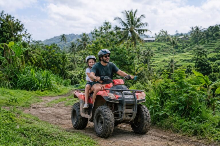 Parent and child riding a tandem ATV in Bali